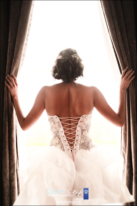 Bride opening curtains