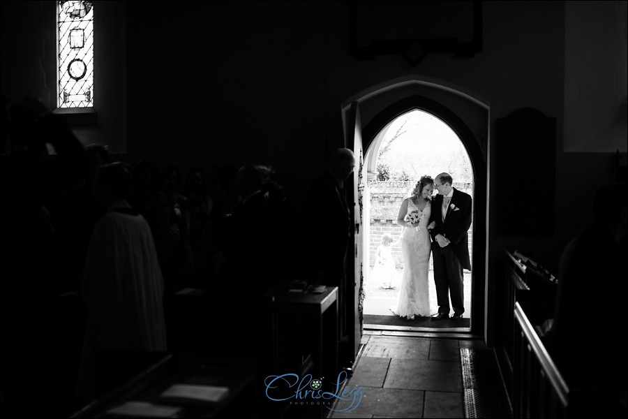 Bride and her father standing waiting to enter the church