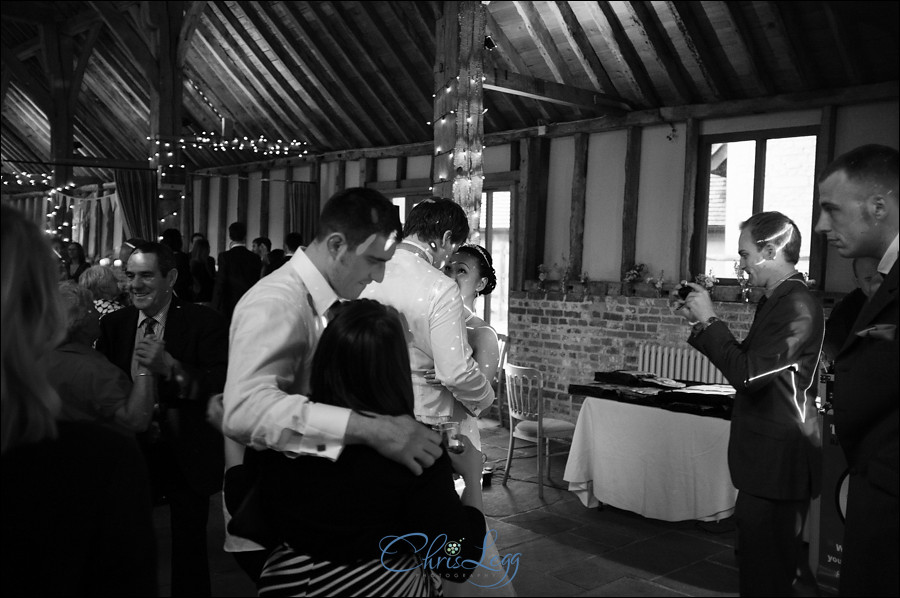 Black and white image of bride and groom dancing