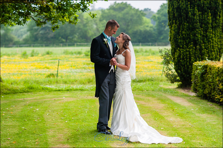 Bride and groom standing together in the gardens of Culeaze House