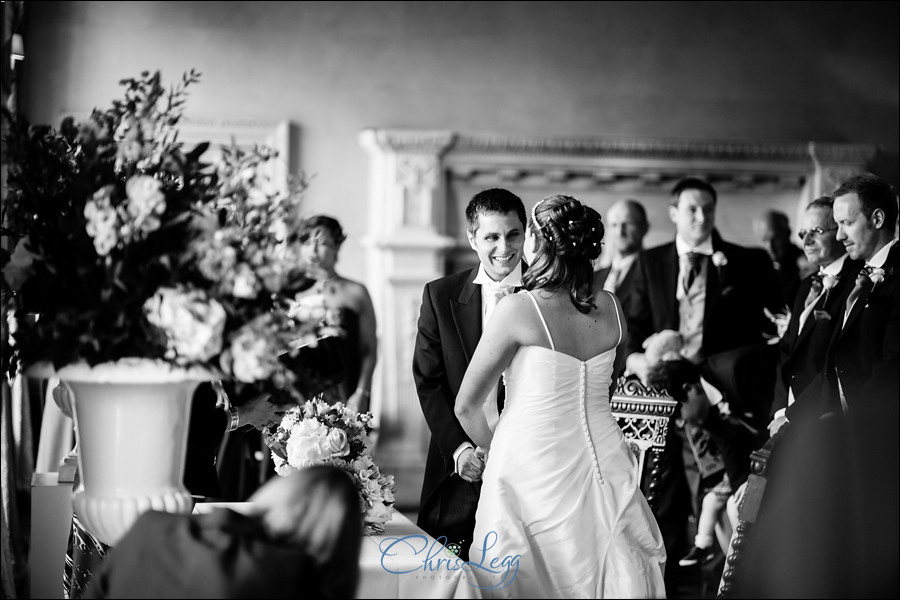 Bride and groom saying their vows in Hampton Court House